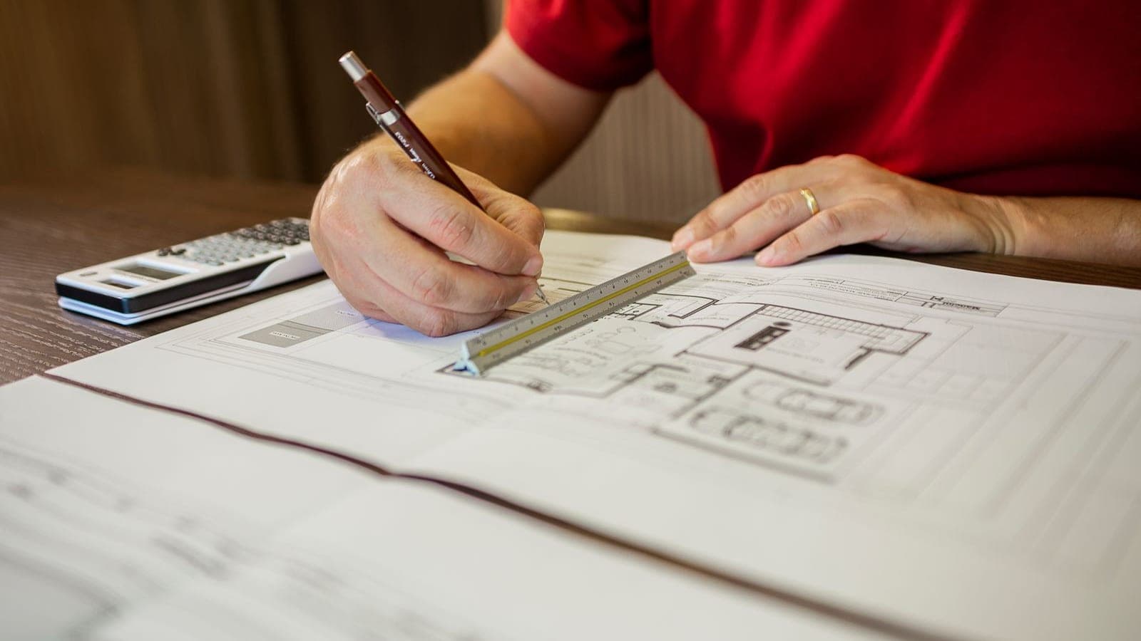 Close-up of a person drawing a trade show booth floor plan