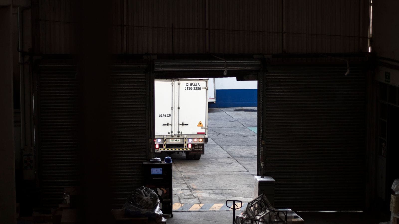 Delivery truck at a warehouse loading dock for return freight